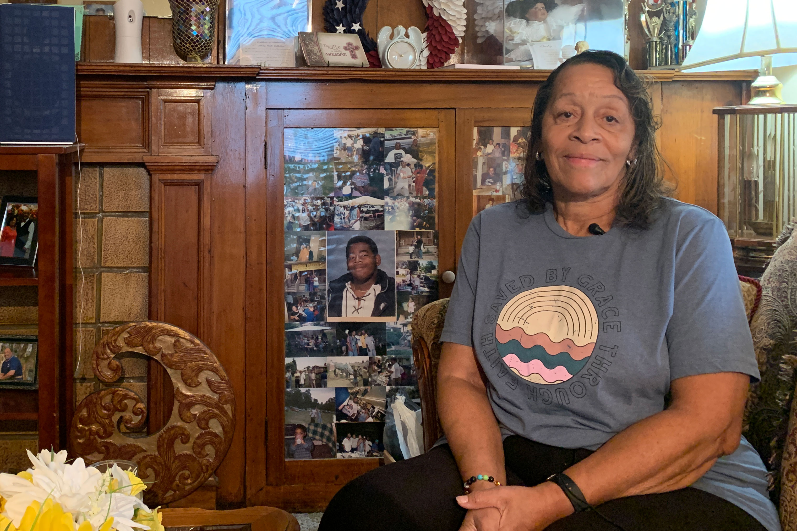 A photo of a woman sitting indoors.