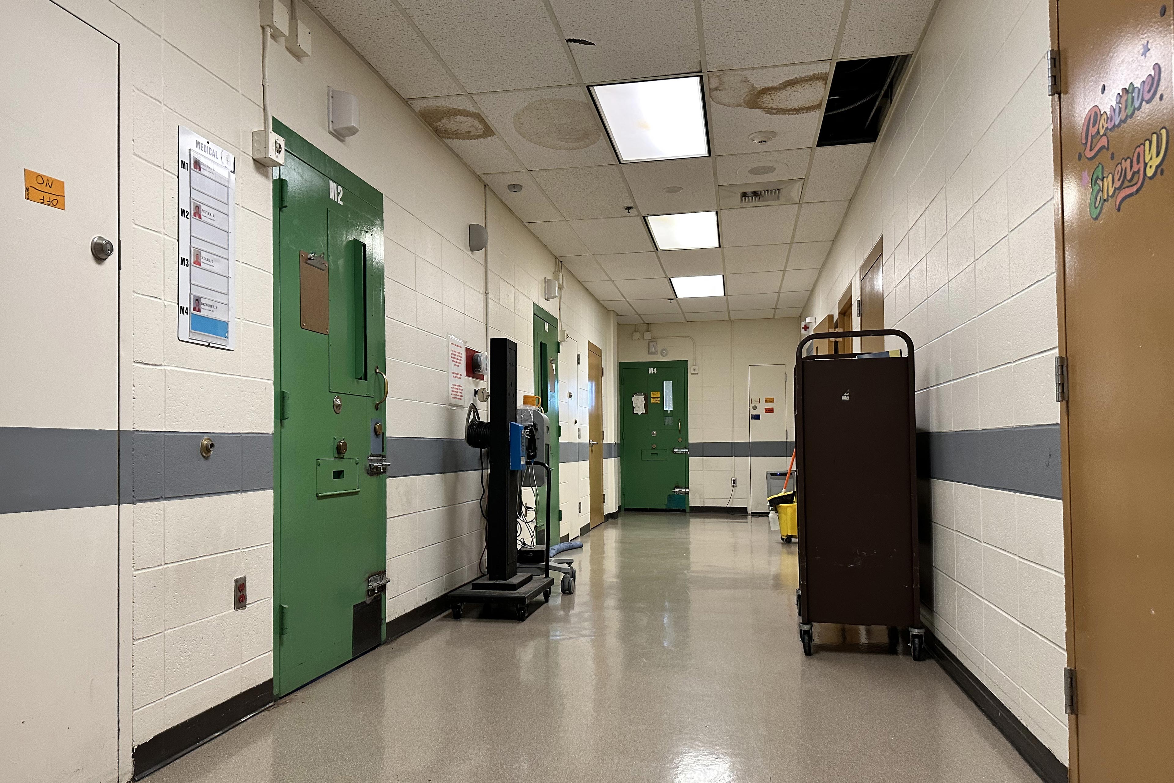 A photo of a corridor inside of a jail.