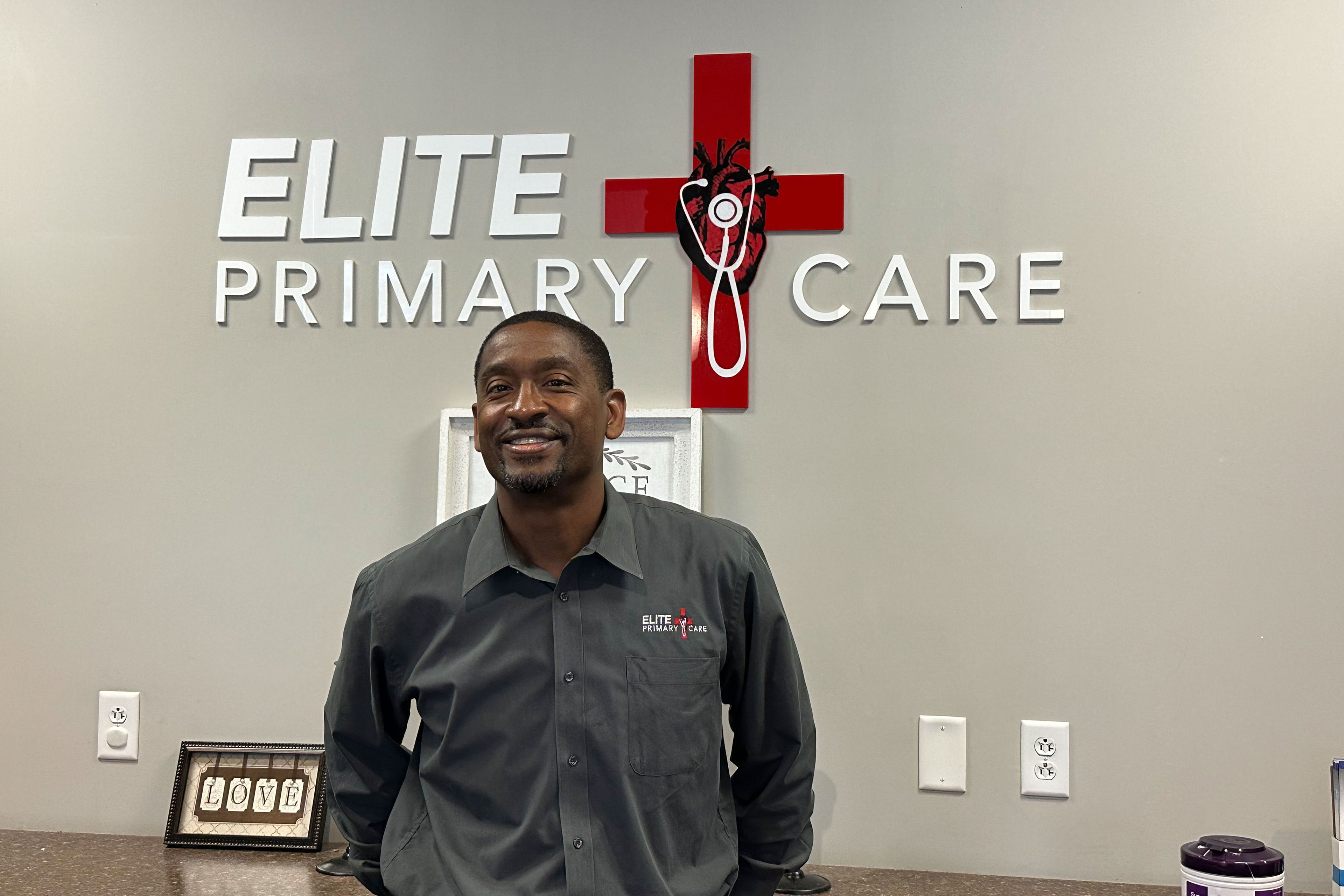 A photo of a doctor inside of an office.