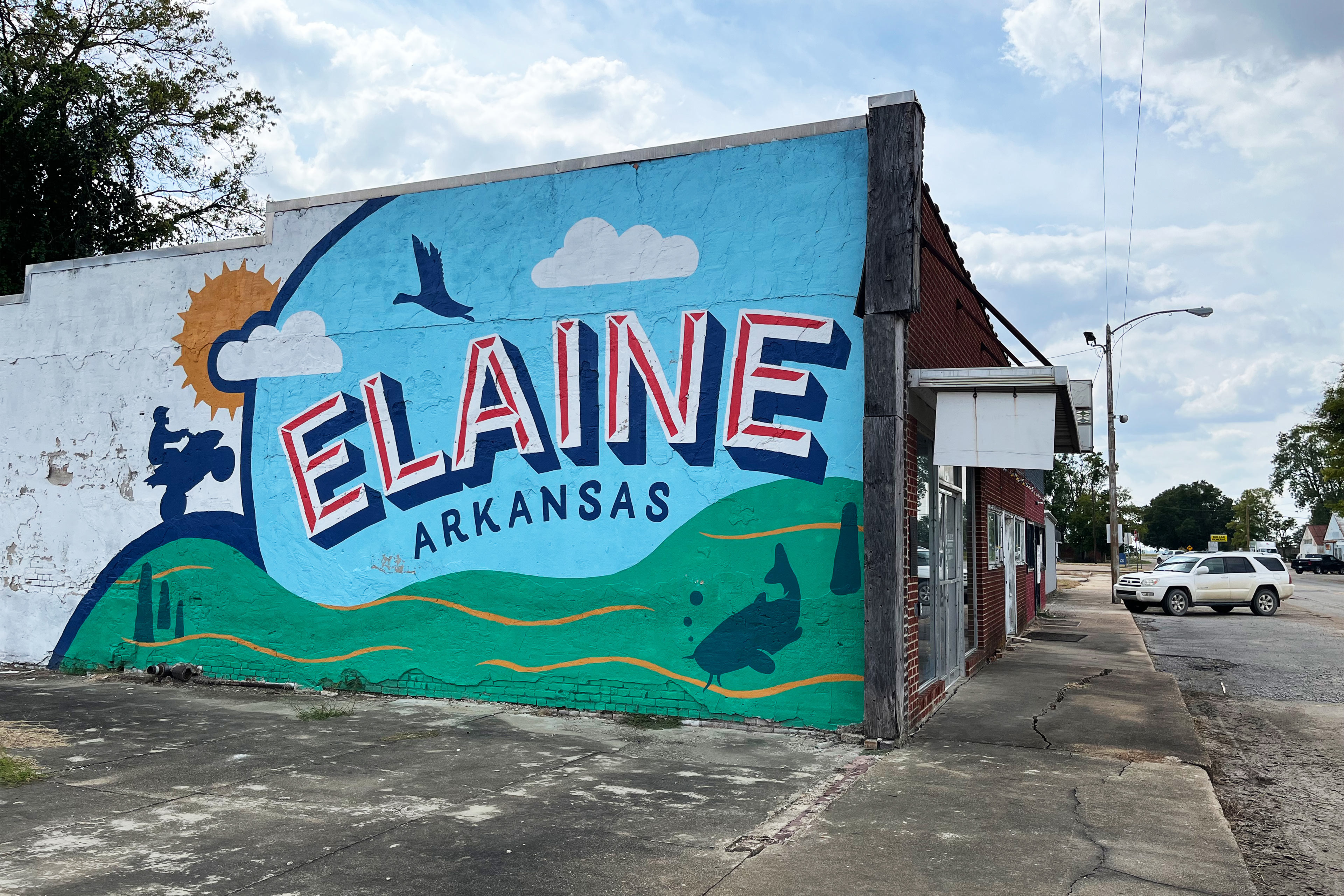 A photo of a colorful mural that reads, 