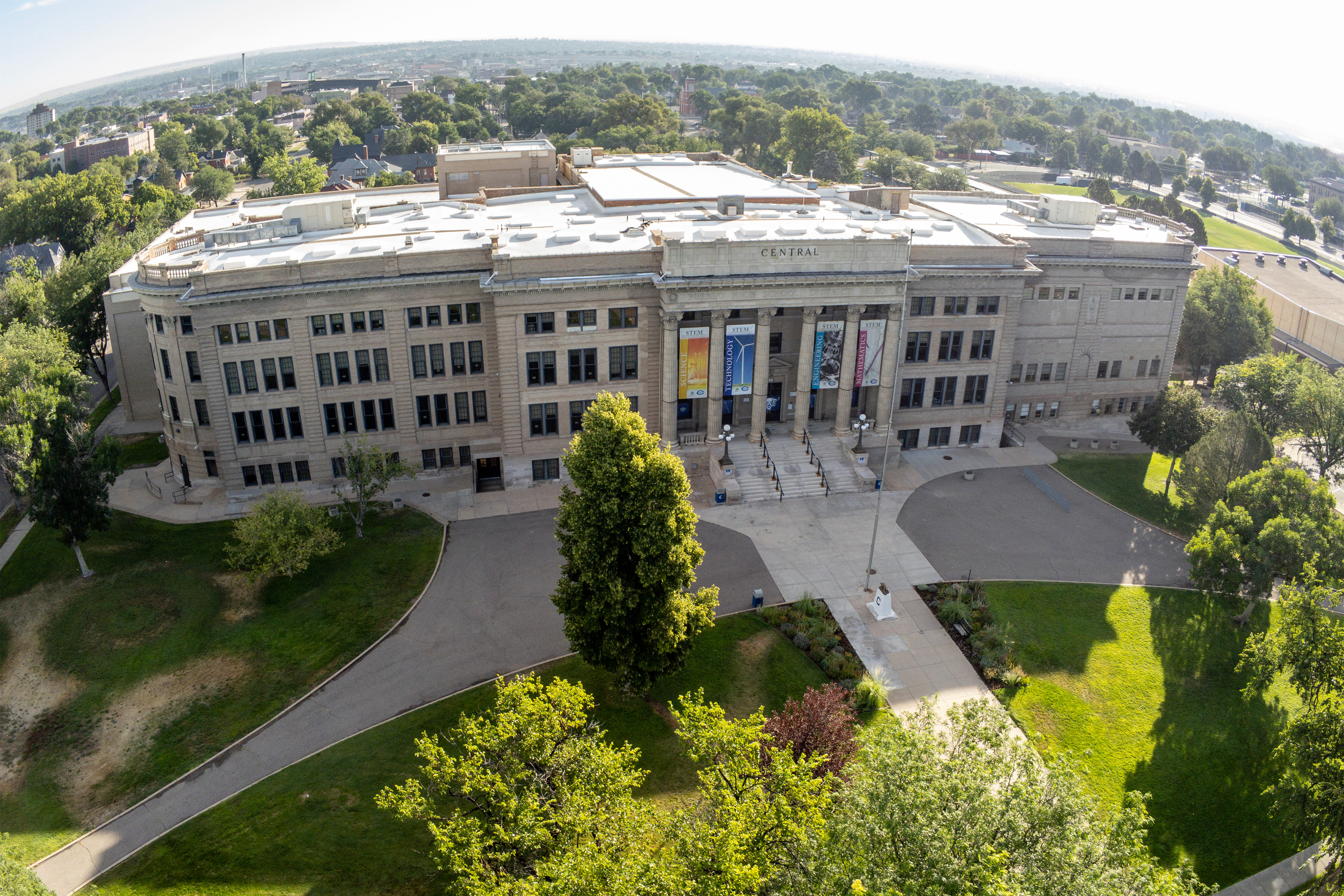 An image of a high school building and its surrounding campus, taken via a drone camera.