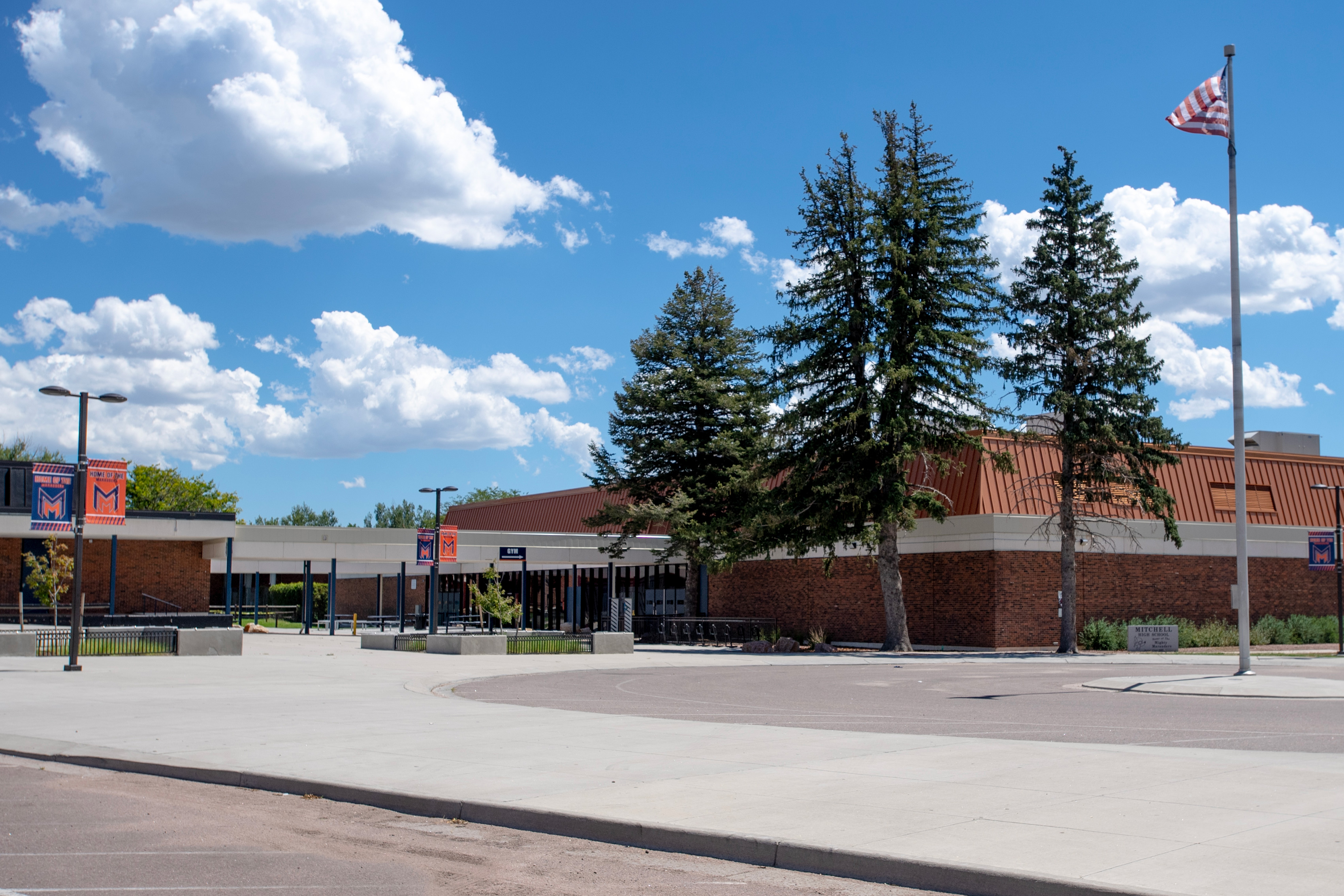 School buildings as seen from a parking lot.