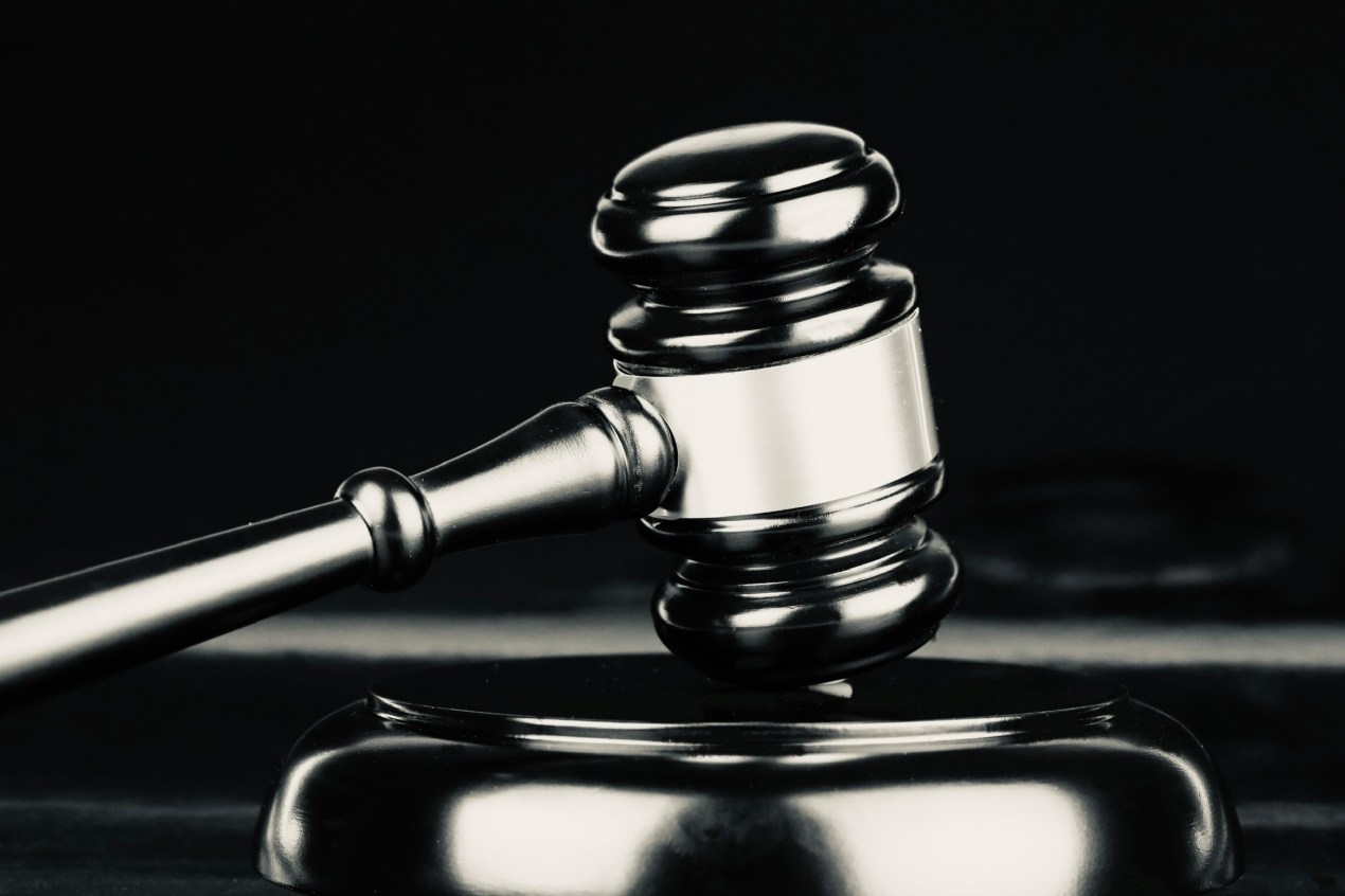 A black and white photo of a gavel.