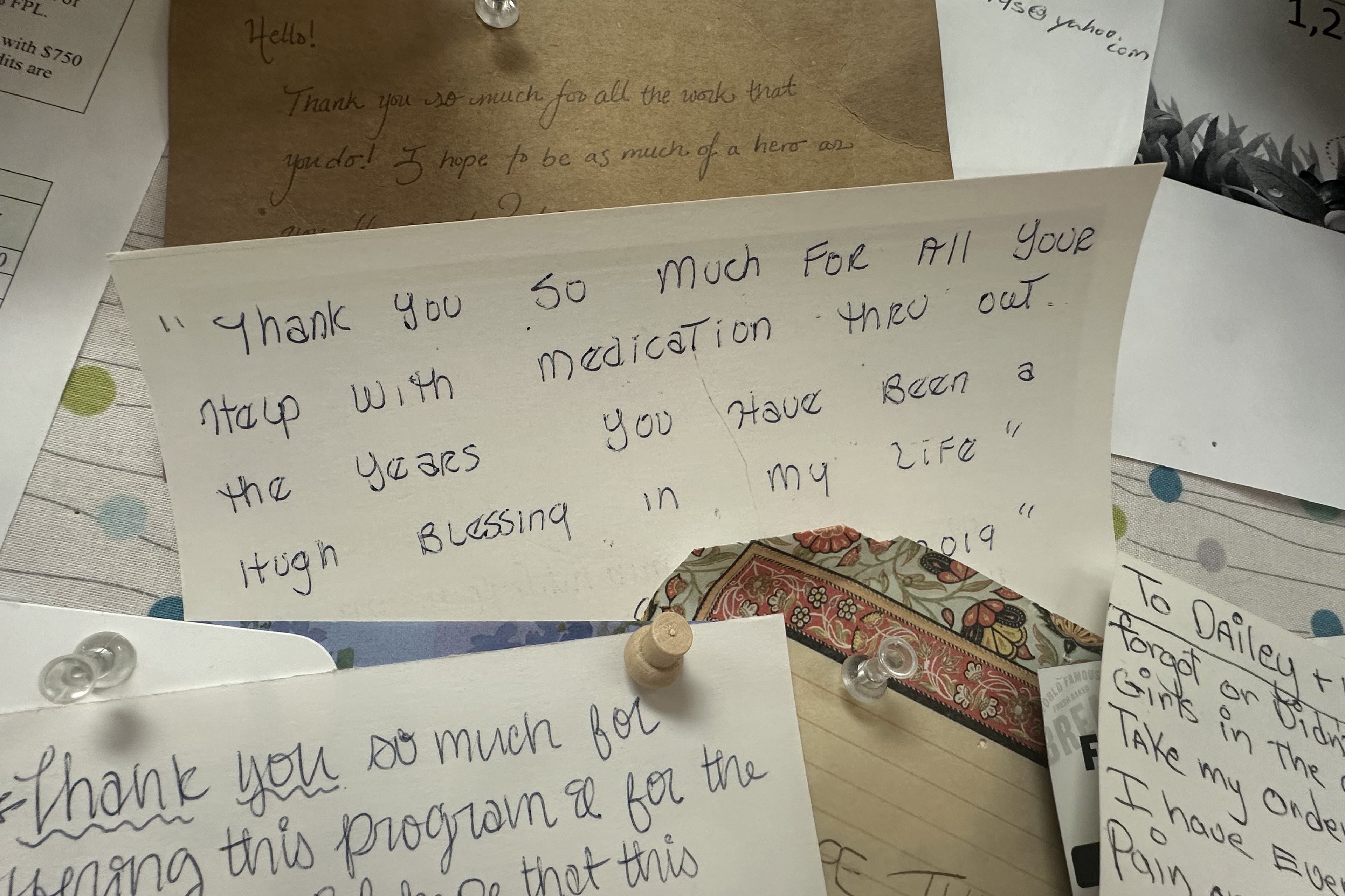 Hand-written thank-you notes are pinned to the wall at the Wyoming Medication Donation Program in Cheyenne, Wyoming. The note at in the center of the board reads, "Thank you so much for all your help with medication thru out the years. You have been a huge blessing in my life."