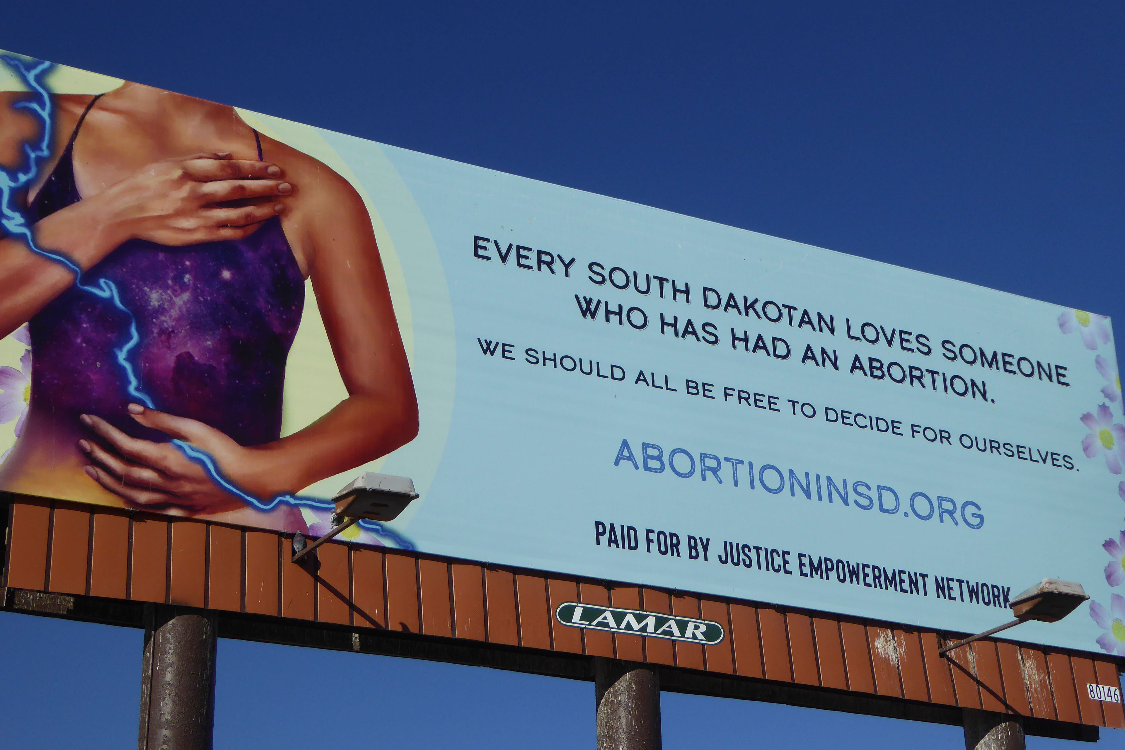 A pro-choice billboard by the Justice through Empowerment Network reads, "Every South Dakotan loves someone who had an abortion. / We should all be free to decide for ourselves."