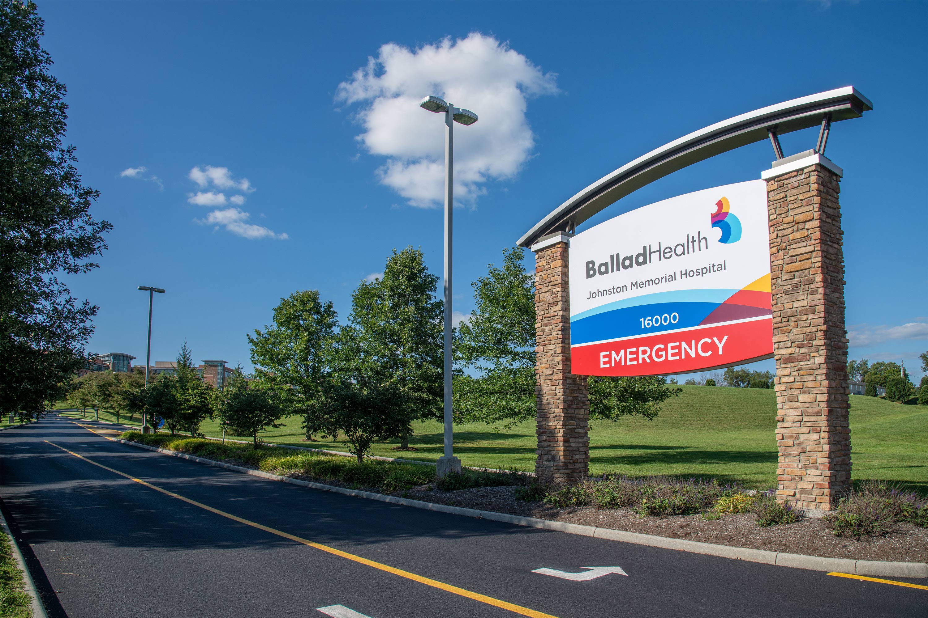 A photo of a sign bearing Ballad Health's logo outside of Johnston Memorial Hospital.