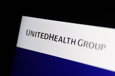 A photo of a laptop screen showing UnitedHealth Group's logo.
