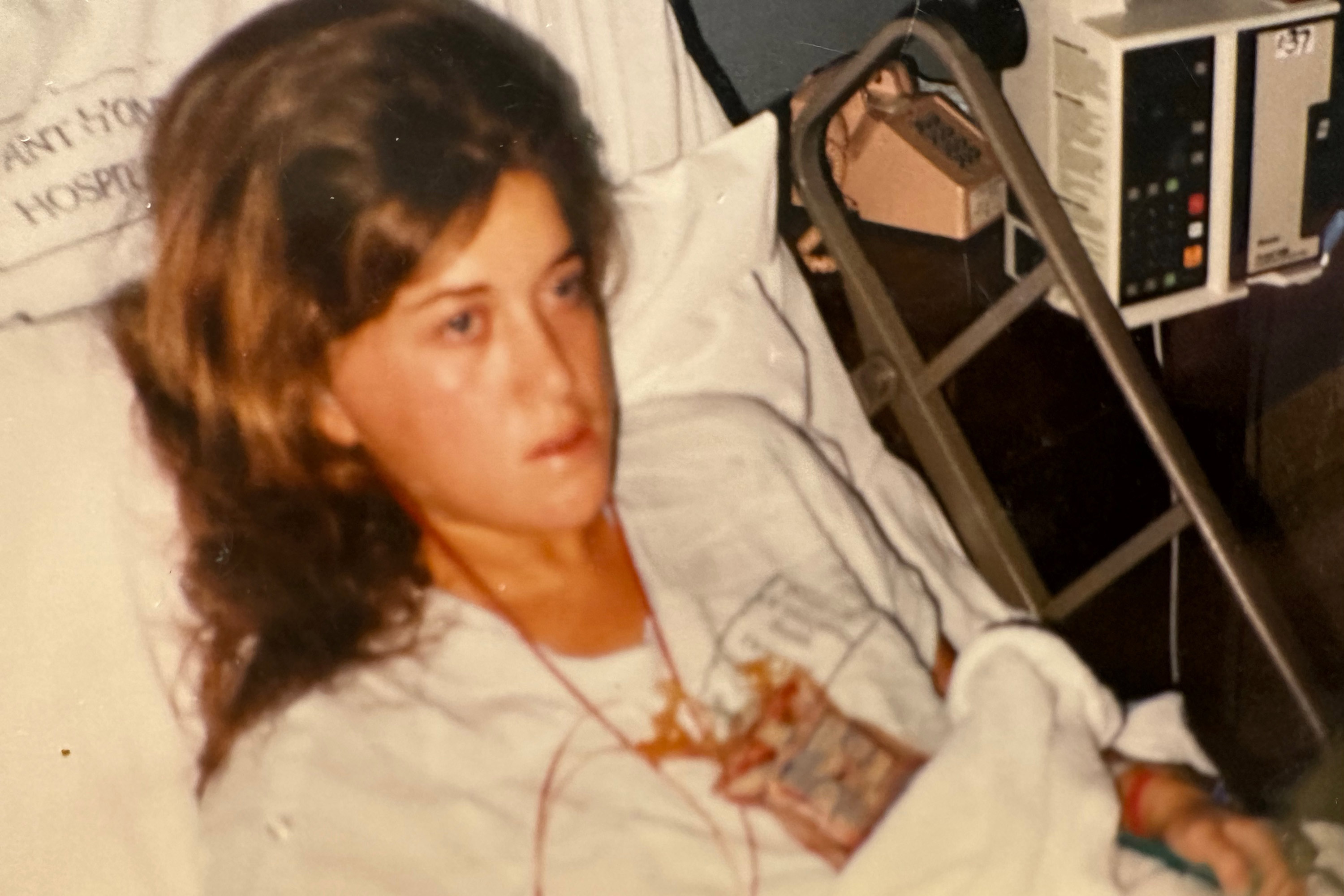 A photo of a teenager in a hospital bed.