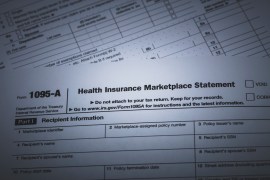 photo of IRS Form 1095-A used for reporting health insurance coverage on the IRS income tax report.