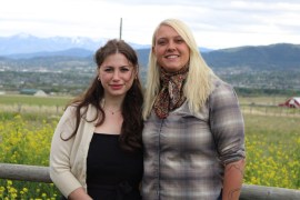 Sophia Ferst (left) stands beside her wife, Madison Bethke (right), outside of Helena, Montana.