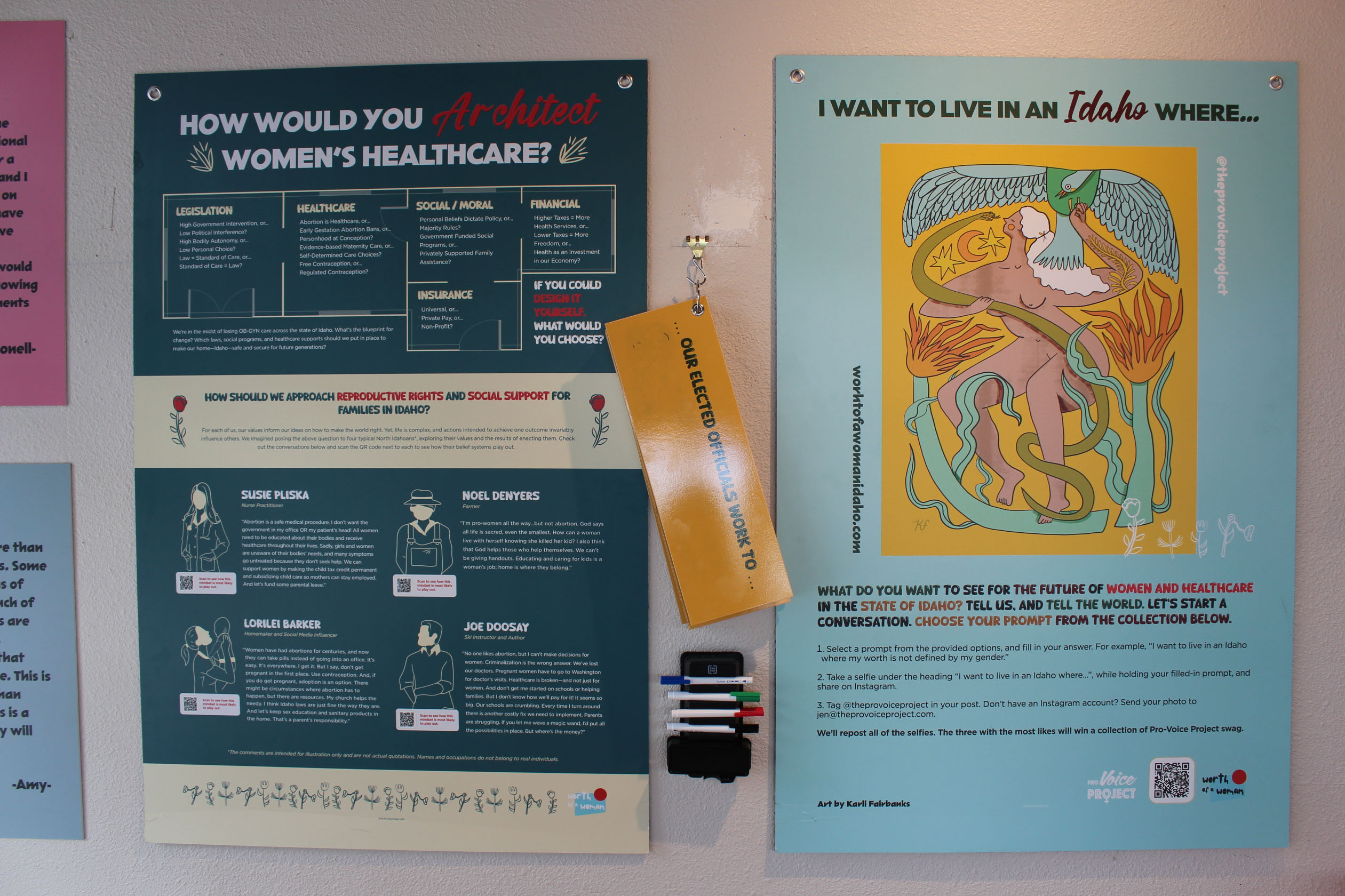 Picture of two posters on the wall. The poster on the left says, "How would you design women’s health care?" and it is further divided into sections say "Legislation," "Health care," "Social/moral," "Insurance," And "financial." Below, it further says, "If you could design it yourself, what would you choose? / How should we approach reproductive rights and social support for families in Idaho?" After this there is a section containing information about some eminent personalities. The poster on the left says, "I want to live in an Idaho where... / What would you like to see for the future of women and healthcare in the state of Idaho? Tell us, and tell the world. Let's start a conversation. Choose your prompt from the collection below."