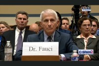 A still from a video showing Anthony Fauci sitting at a table before a House of Representatives committee.