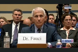 A still from a video showing Anthony Fauci sitting at a table before a House of Representatives committee.