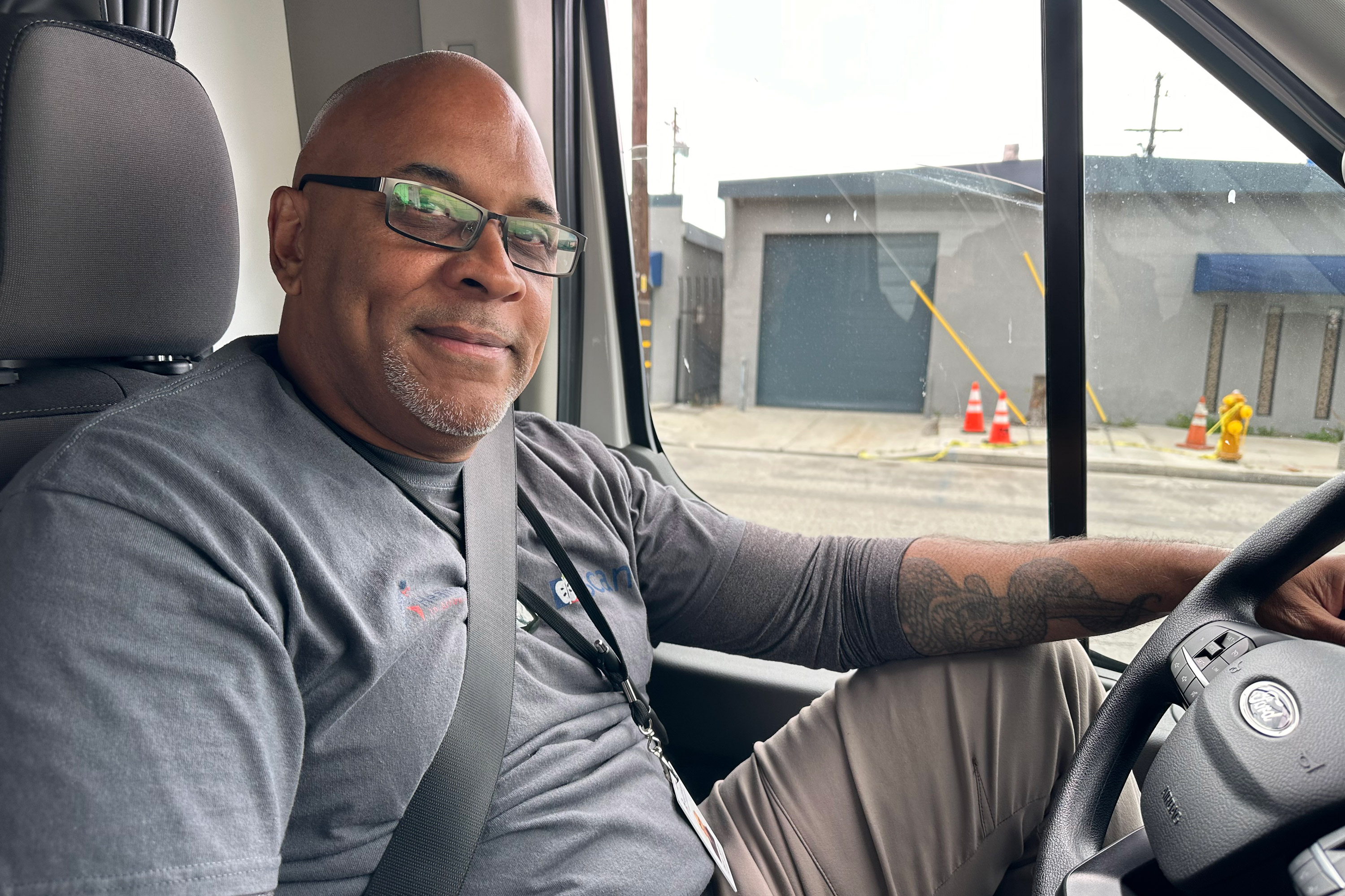 A photo of a man inside a car.