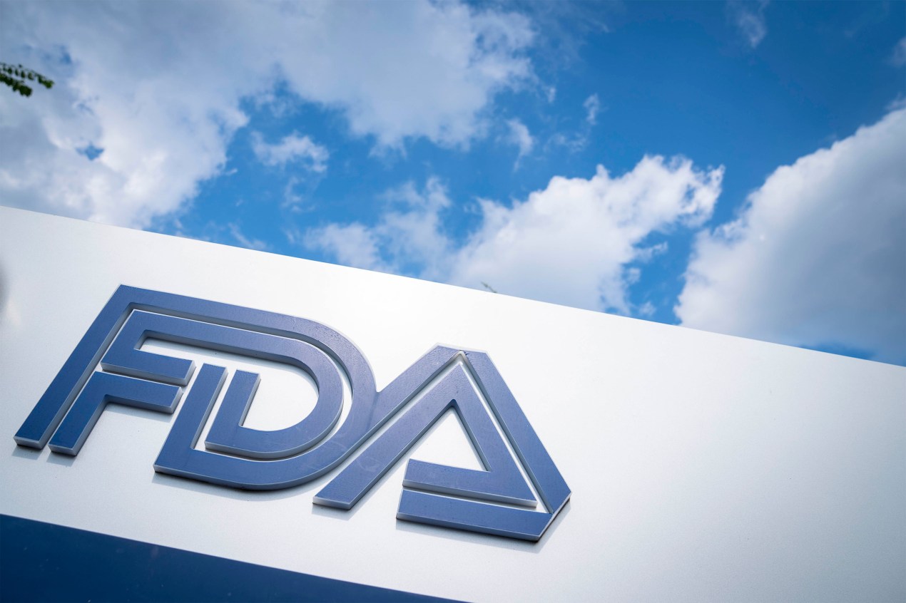 A photo of a sign with the FDA's logo outside its headquarters.