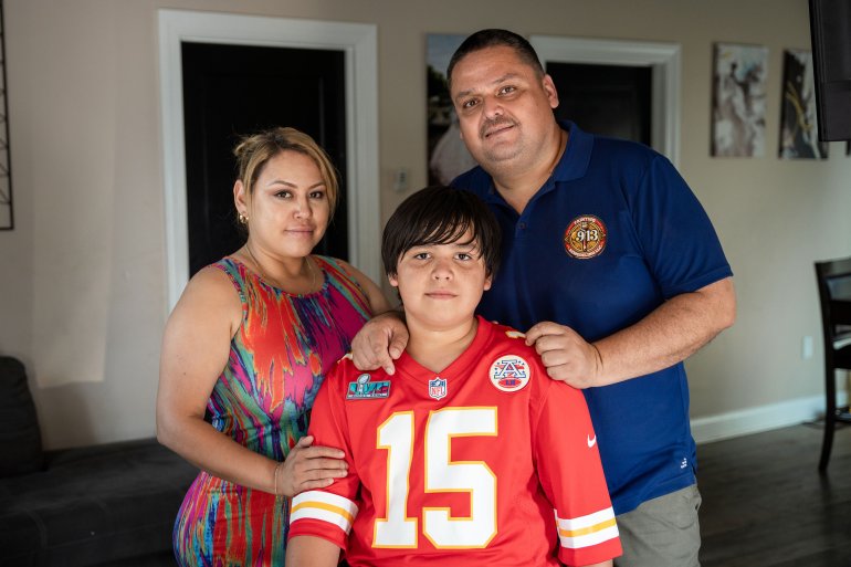 A photo of Samuel Arellano with his parents.