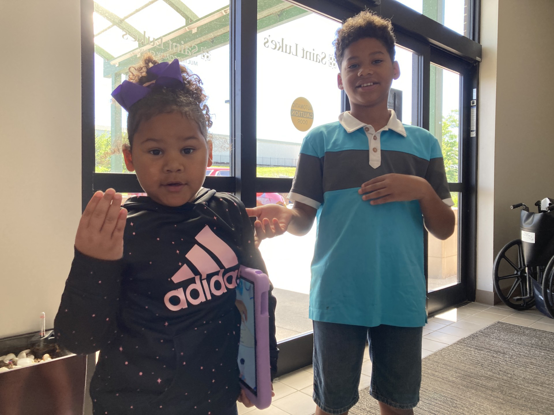 A photo of two children posing together.