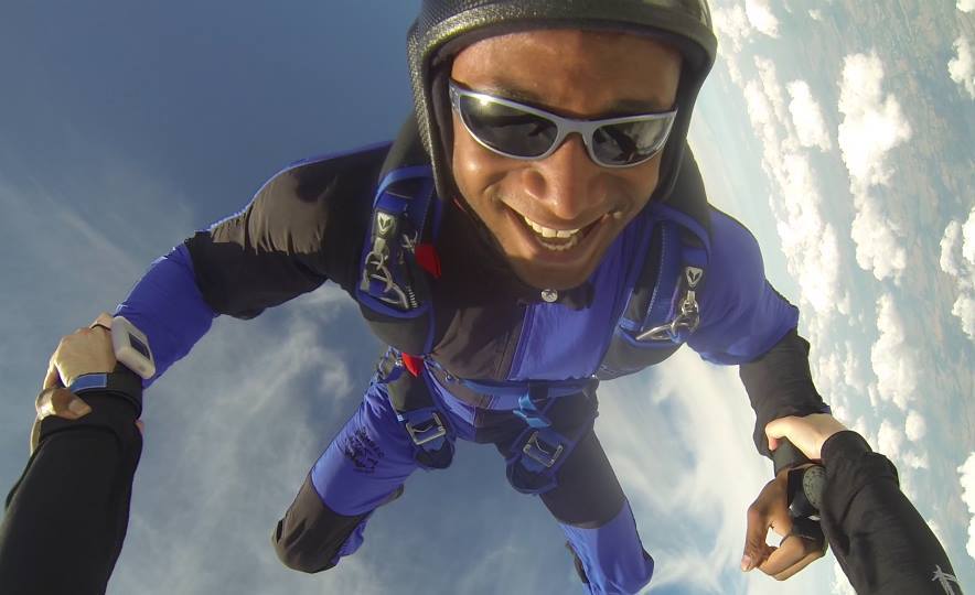 A photo of a man skydiving.