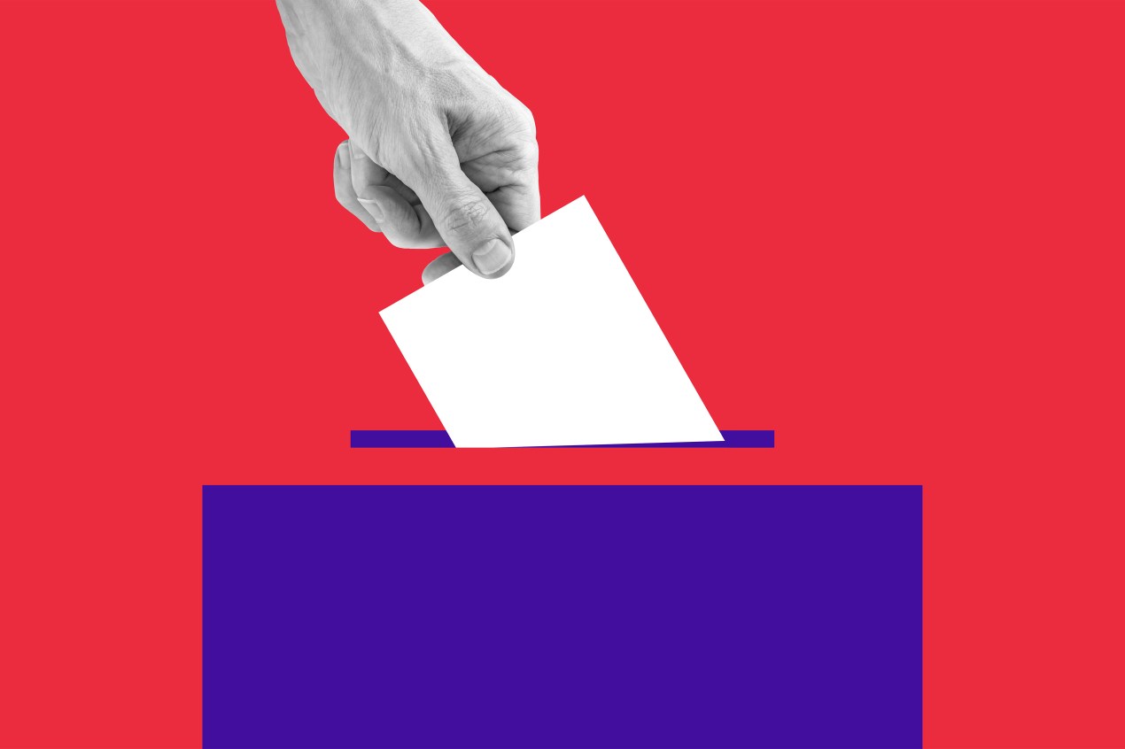 A photo illustration of a hand placing a ballot into a box.