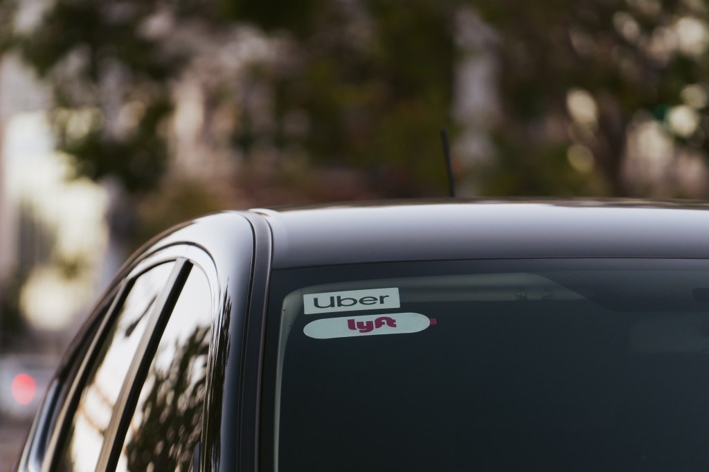 Uber and Lyft signage on a vehicle in San Francisco, California,