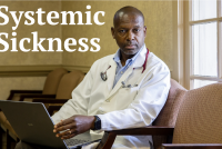 A portrait of a doctor sitting in a chair and looking towards the viewer.