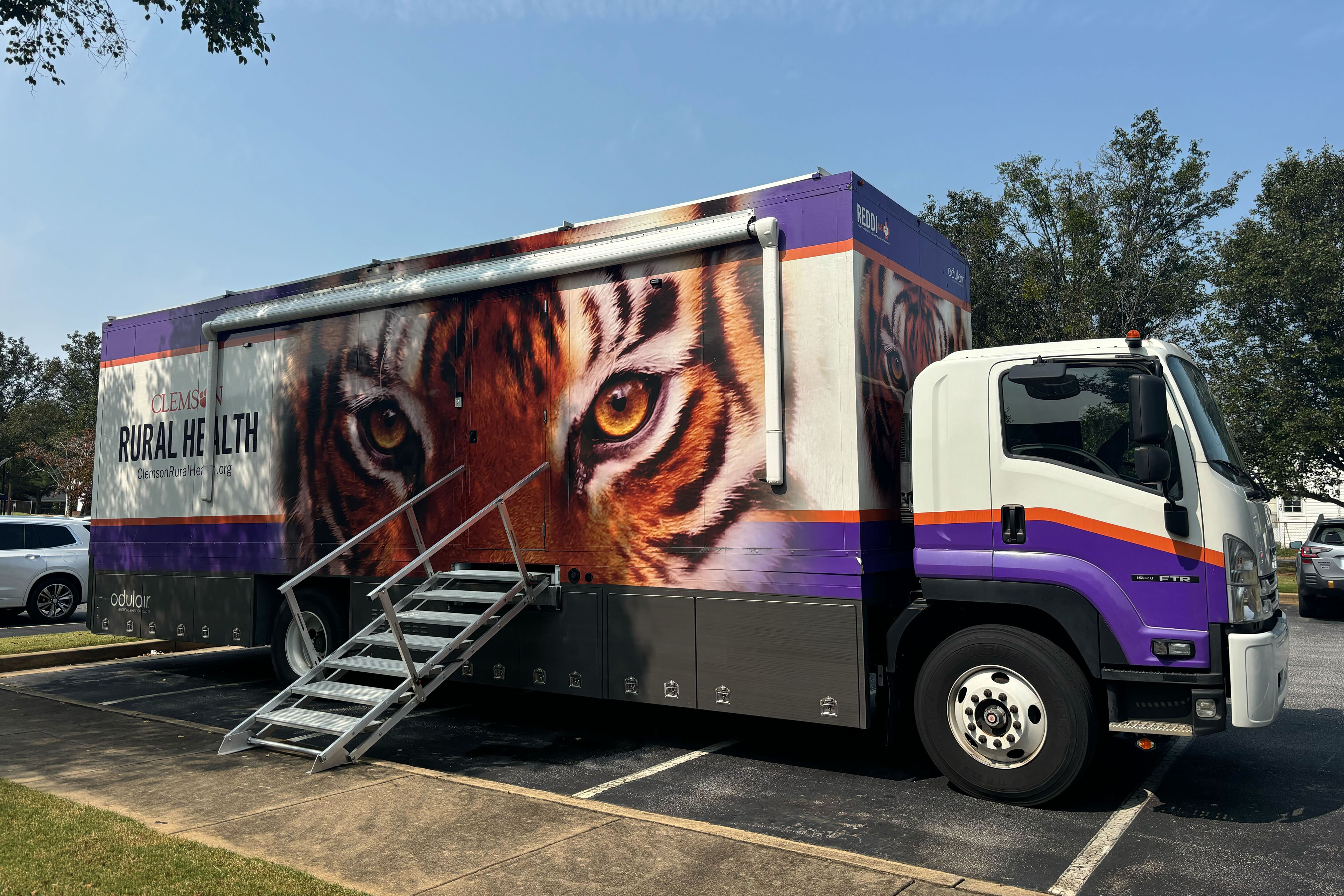 A mobile health care vehicle. It has a tiger painted on the side and says, "rural health."