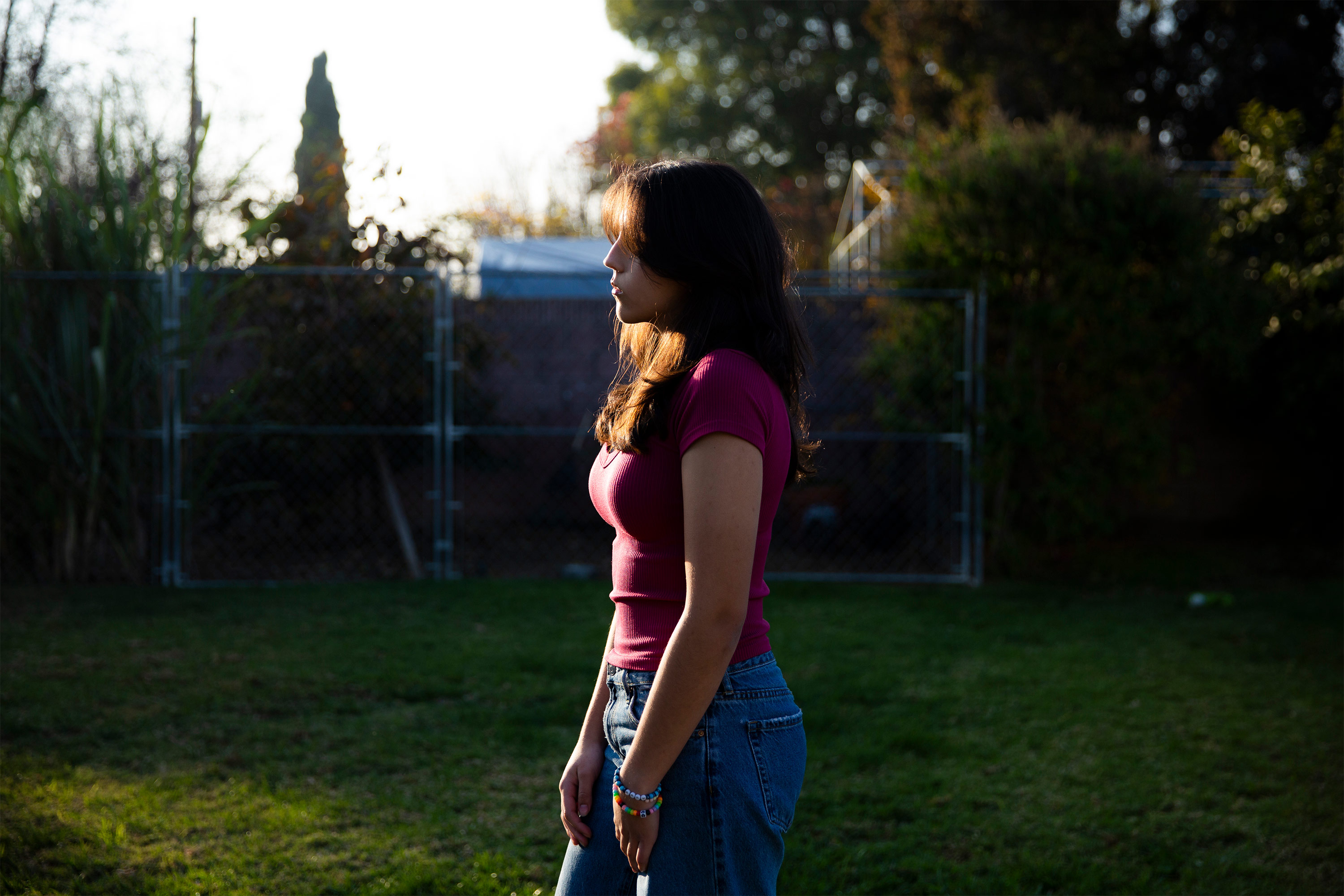 A photo of Abby Rafeek standing for a photo outside.