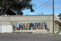 A colorful mural spells out the word "HAVANA" on the side of a building.