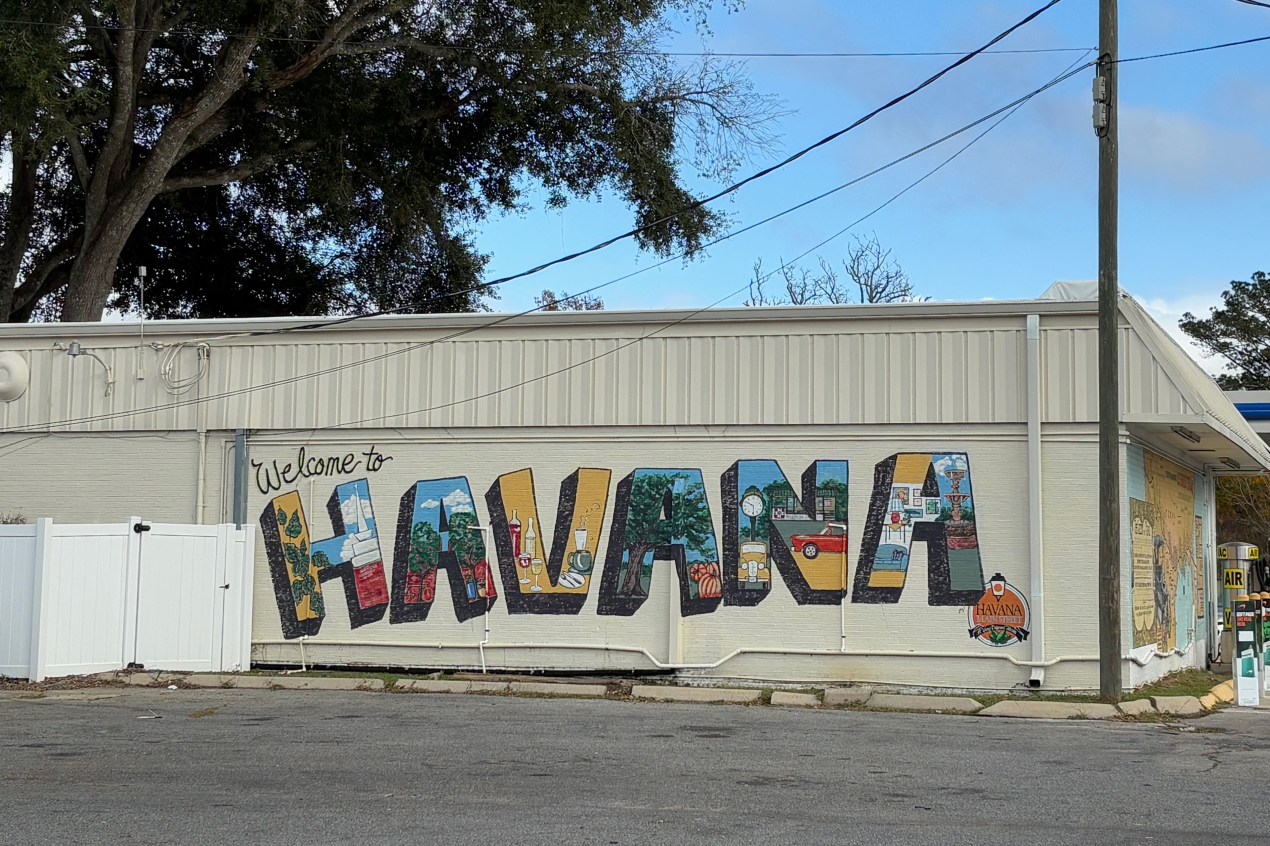 A colorful mural spells out the word "HAVANA" on the side of a building.