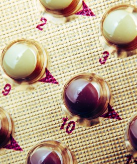A close-up shot of a blister pack of contraceptive pills.