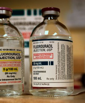 Two bottles of clear medical fluid labeled fluorouracil, for IV use only.