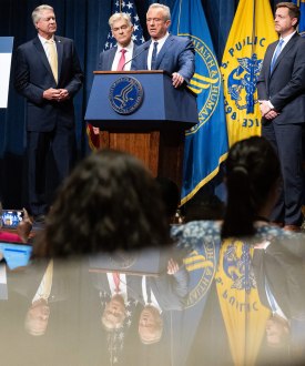 A photo of a news conference featuring Robert F. Kennedy Jr., Mehmet Oz, and Sen. Roger Marshall.