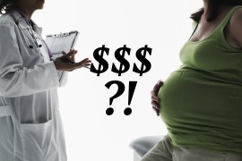 A photo of an unidentifiable doctor and pregnant patient facing one another in conversation.