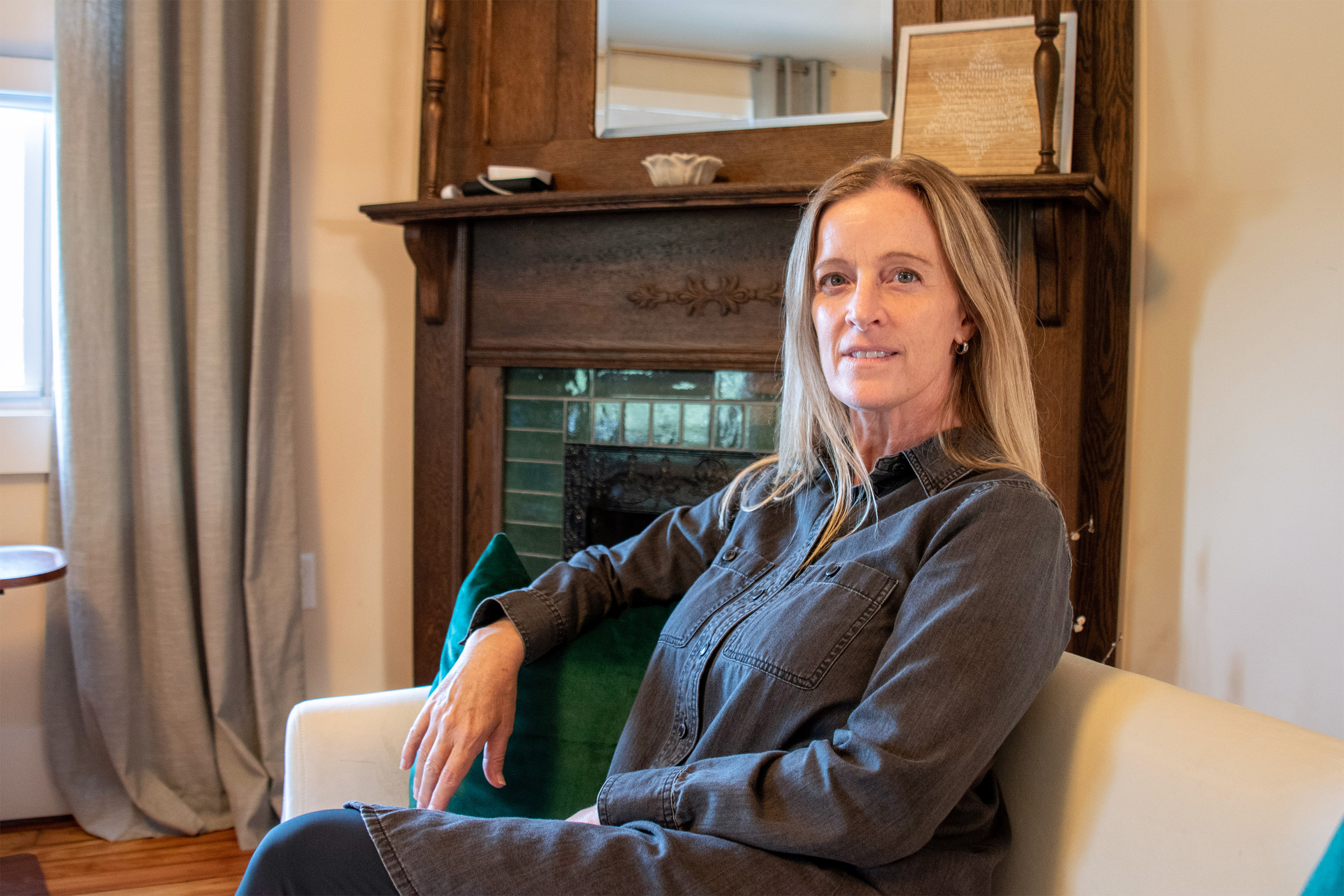 A photo of a psychiatrist sitting in her home.