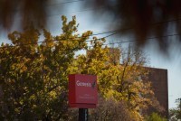A red sign says "Genesis Uptown Rehabilitation Center"