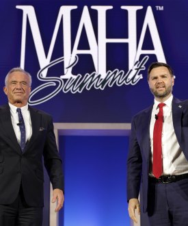 A photo of Robert F. Kennedy Jr. and JD Vance waving to an audience at a conference in D.C. Behind them is a sign reading "MAHA Summit."