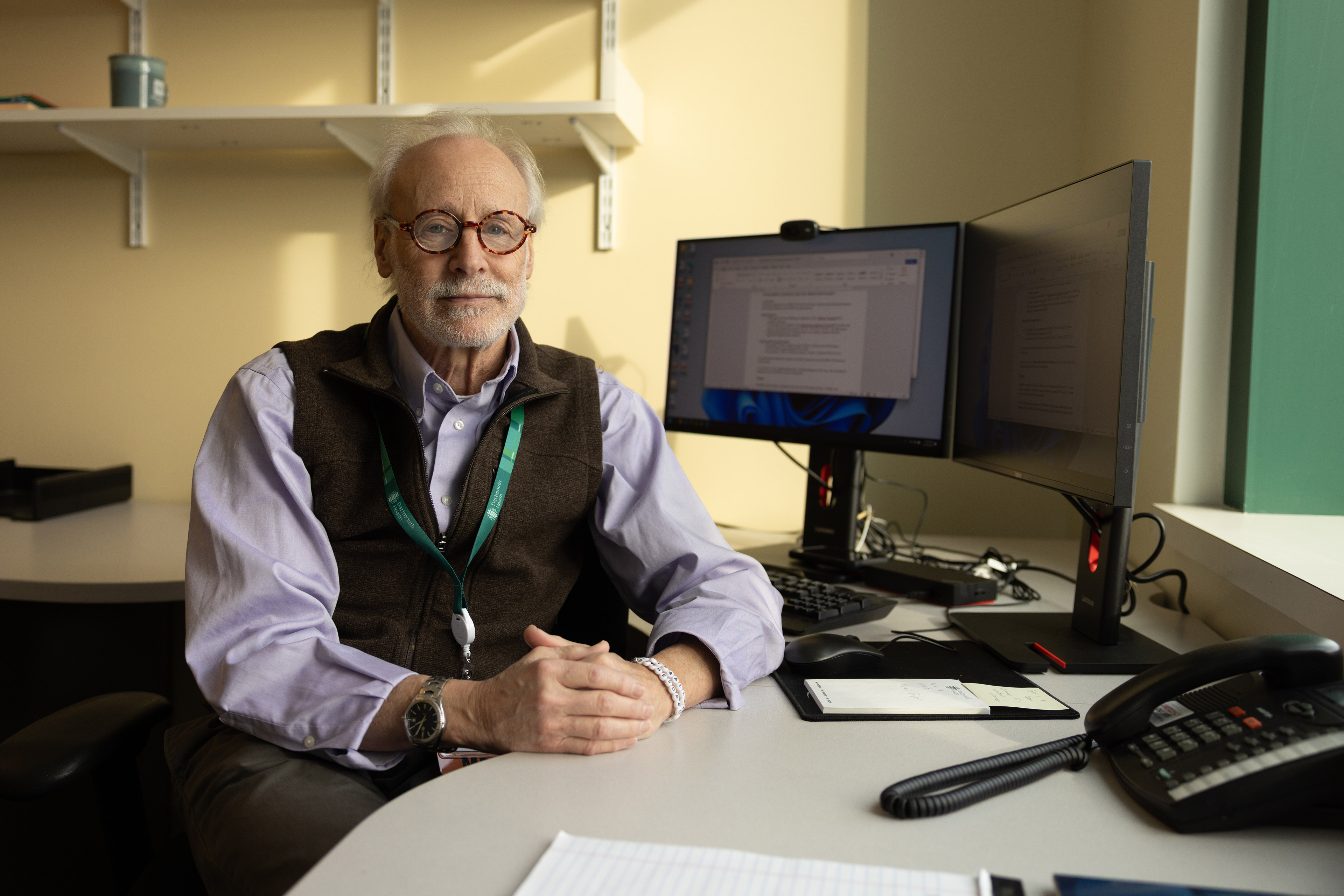 Marc Ernstoff sits at a desk in an office with a computer.
