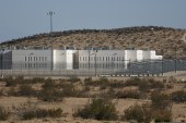 A view of an immigrant detention center California City, California, surrounded by the landscape of the Mojave Desert.