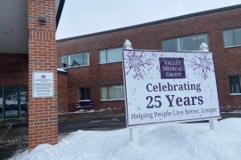 The exterior of a medical clinic with a sign reading "Celebrating 25 years"