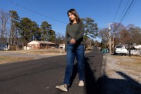 Sheldon Ekirch walks along a street in her neighborhood.
