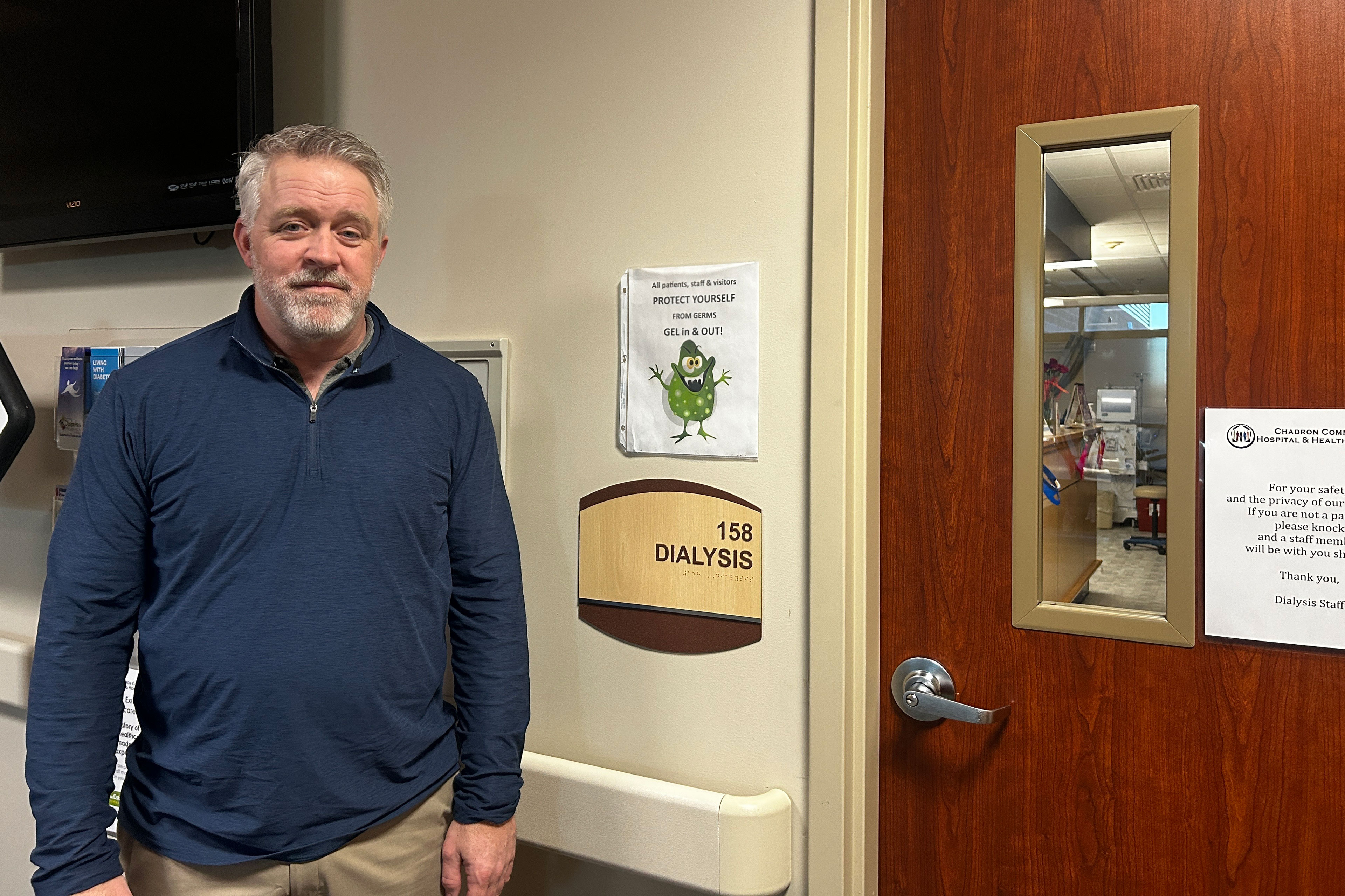A photo of Jon Reiners standing by the now-shuttered dialysis unit at Chadron Hospital.