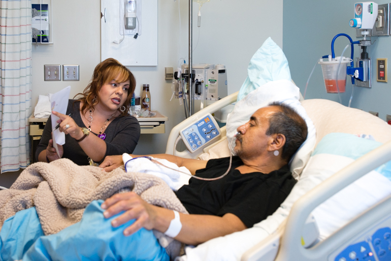 Medical interpreter Veronica Maldonado listens to physician Faheem Jukaku as he explains recent test results to patient Alfredo David at Riverside University Health System Medical Center in Moreno Valley, Calif., on Thursday, June 9, 2016. Maldonado translates the information from English to Spanish for David. (Heidi de Marco/KHN)