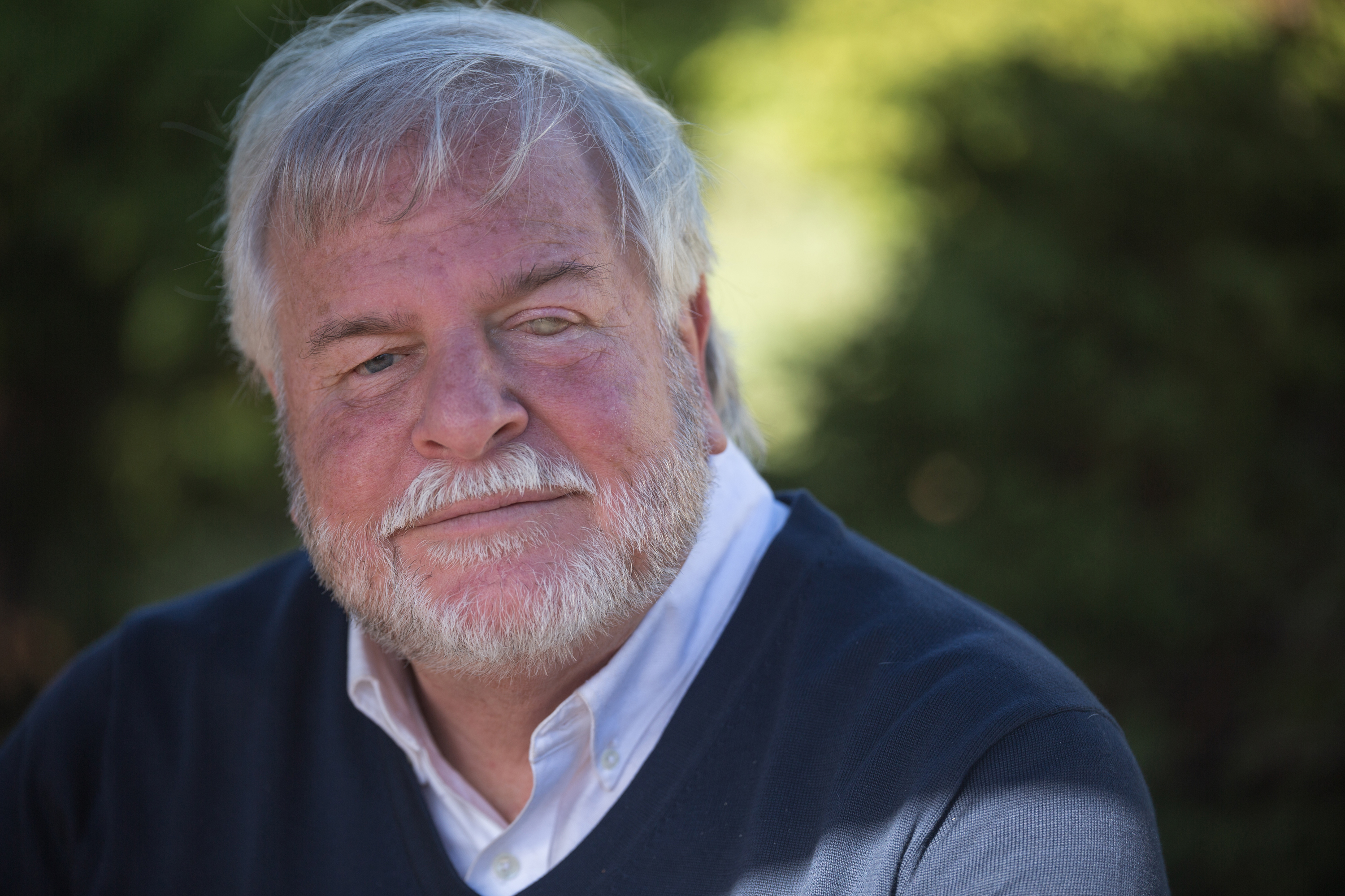 close up of senior man with grey hair and beard