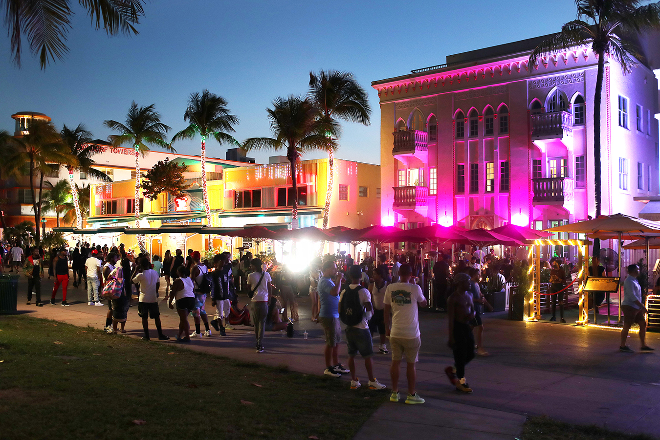 People walk along Ocean Drive on March 18, 2021 in Miami Beach, Florida