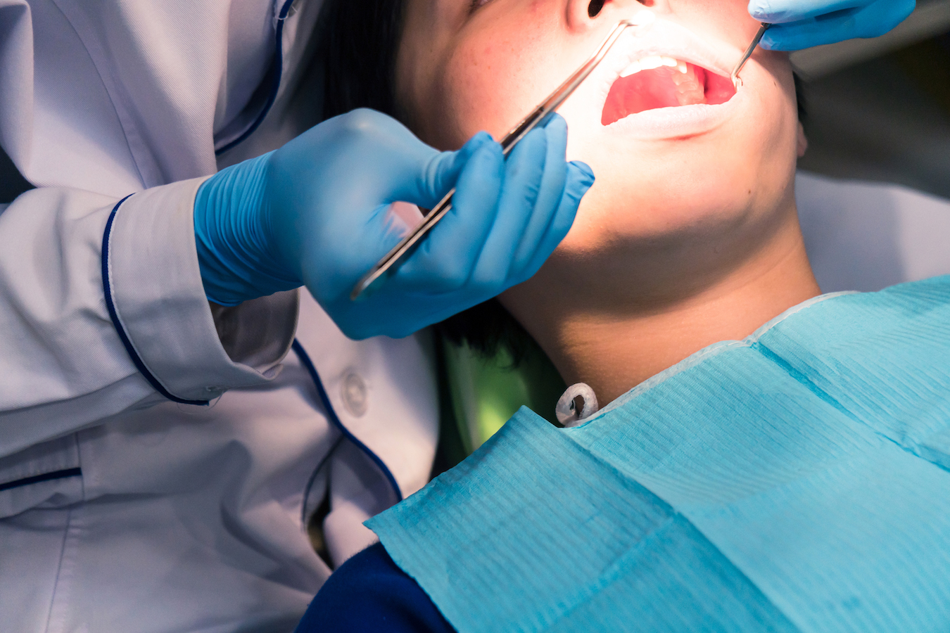 Dentist examining patient