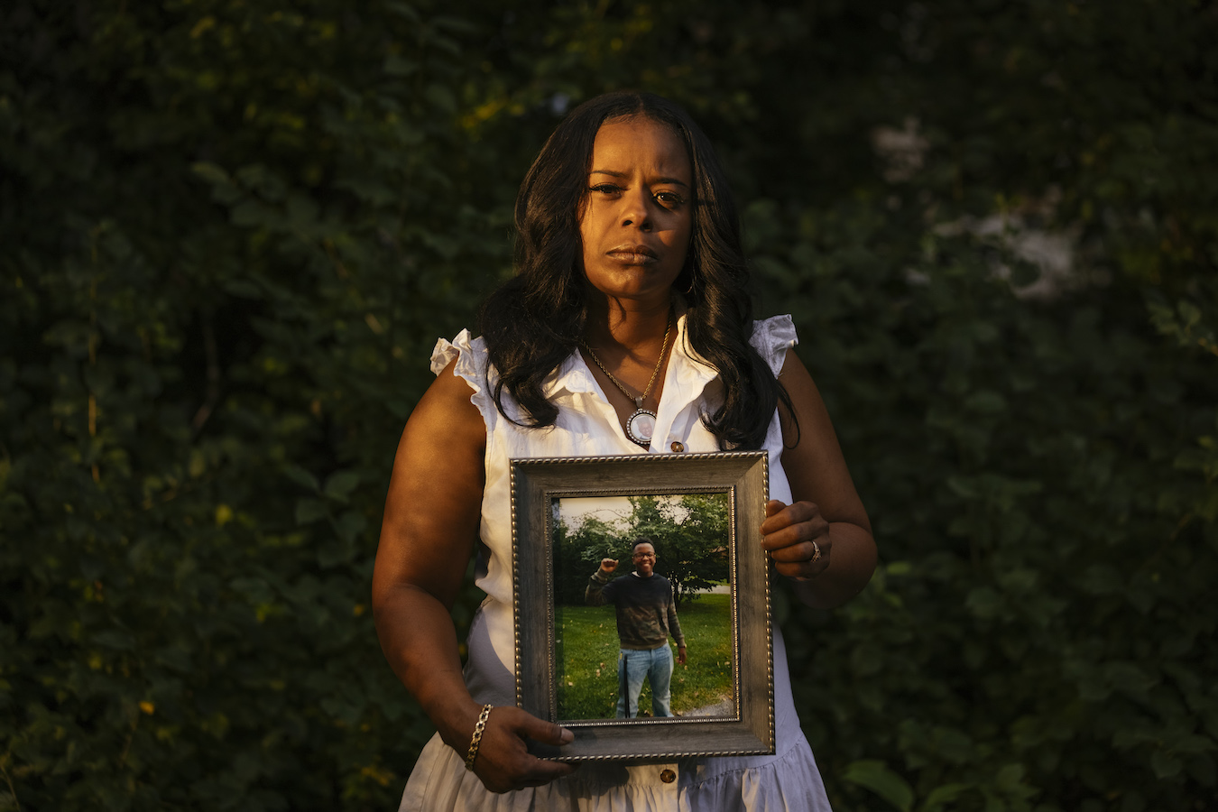 Rafiah Maxie holds a photo of her son, Jamal Clay