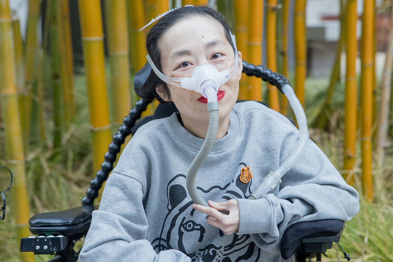 A photograph of Alice Wong, an activist and writer, is seen.