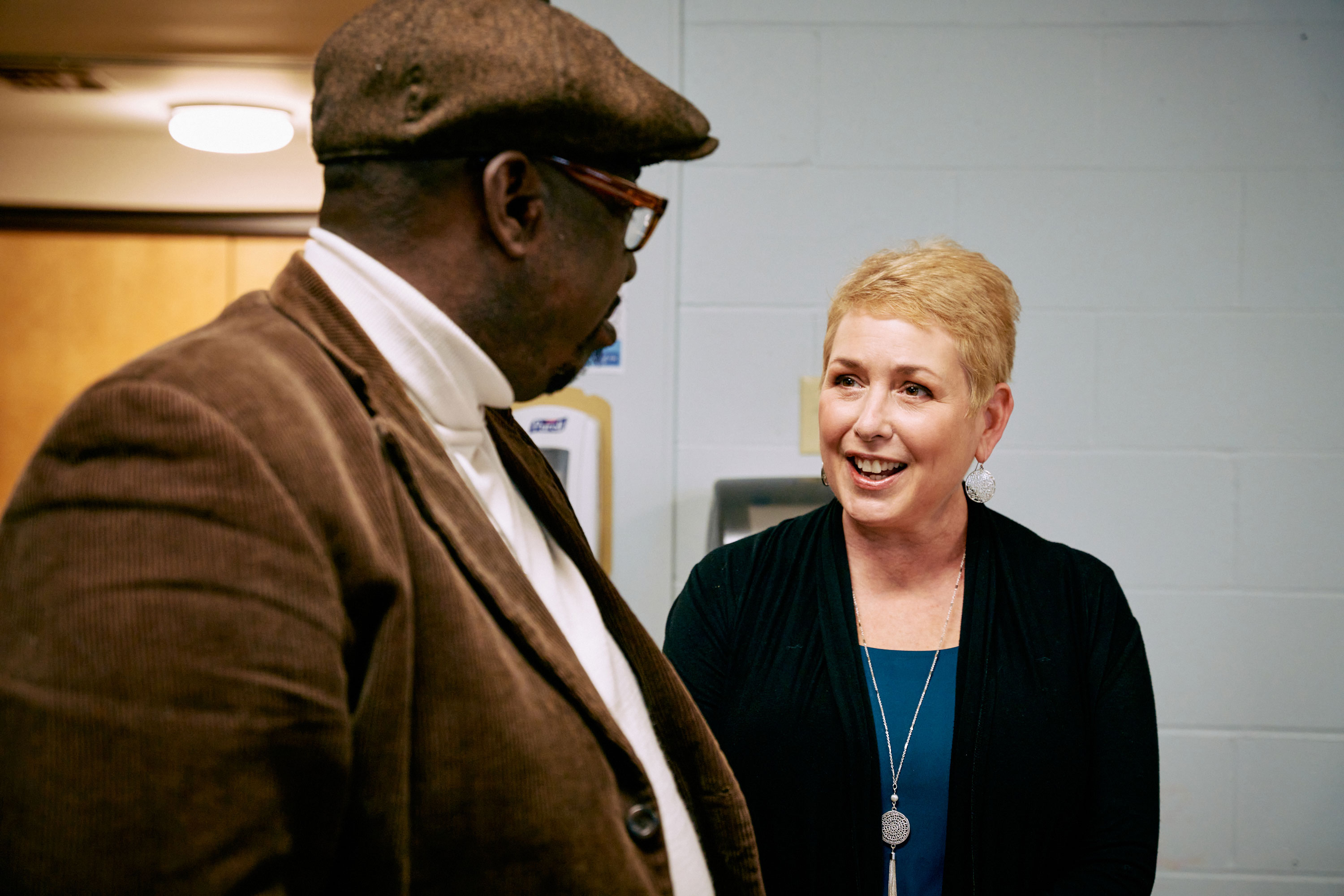 A man and a woman talk.