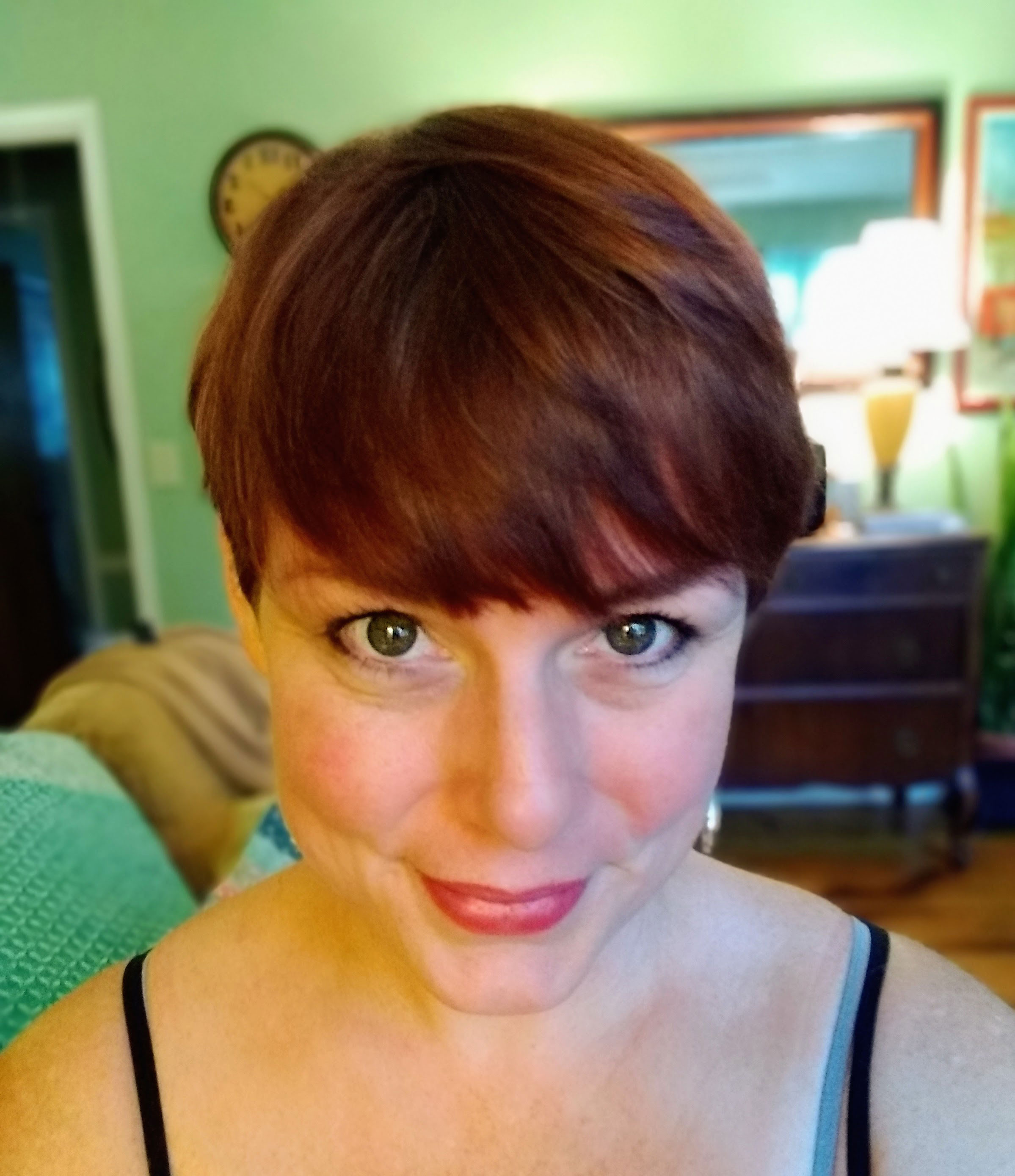 A selfie taken by a woman with short hair.