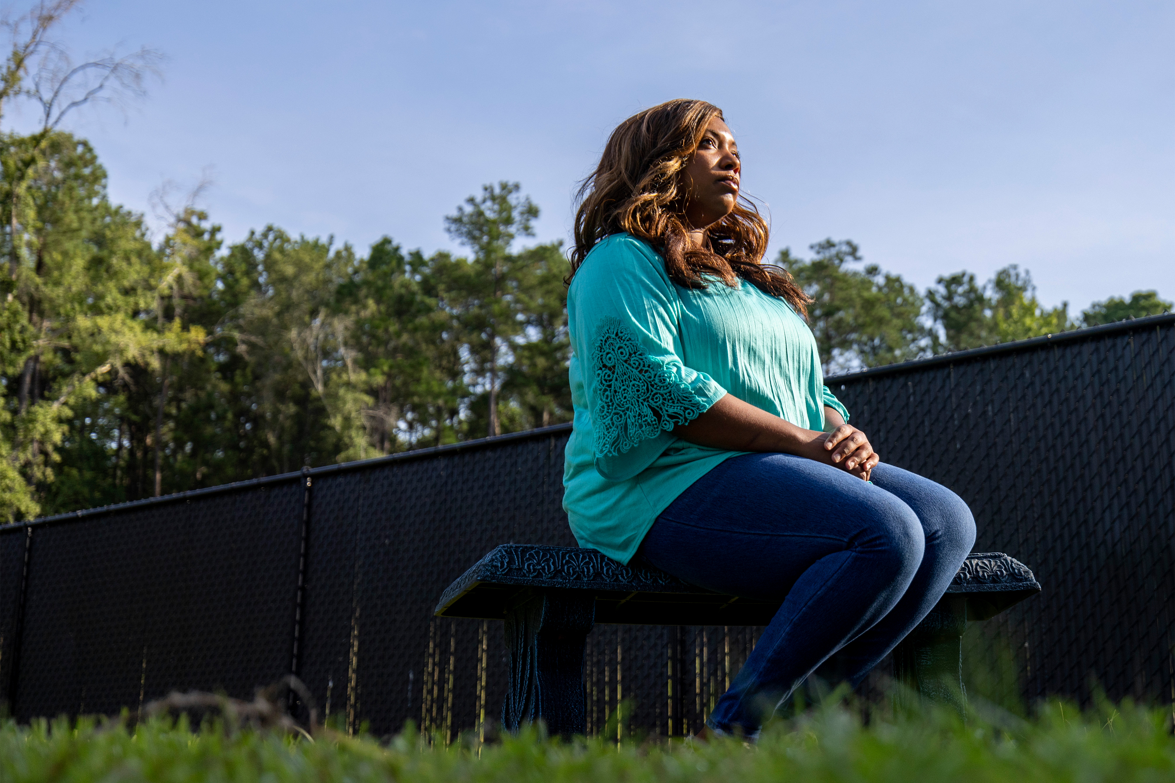 A photo shows Dani Yuengling sitting in a chair outside, looking away from the camera.